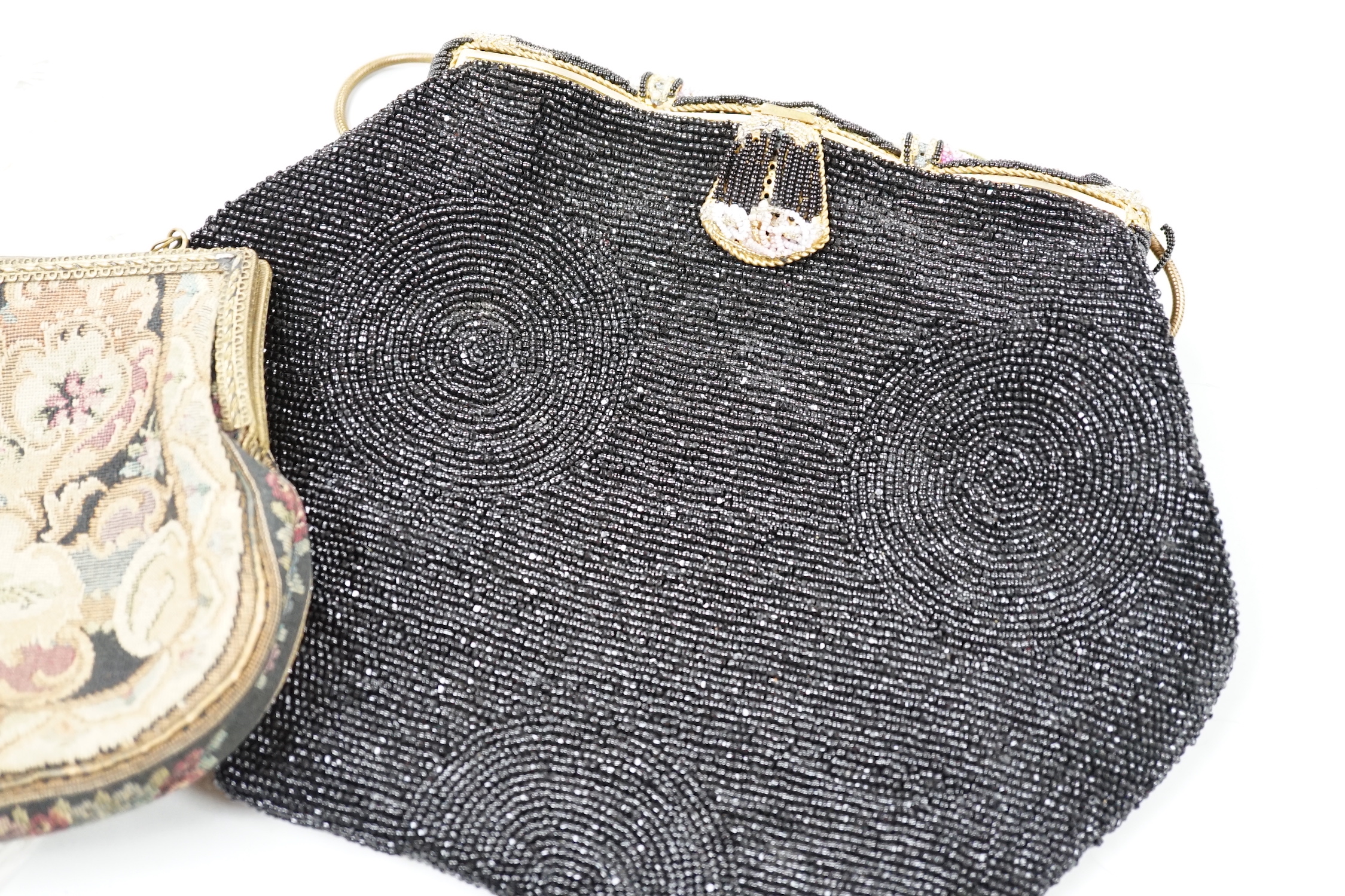 A beadwork bag and a petit point bag with a tortoiseshell and ostrich feather fan, bead bag 19cm high